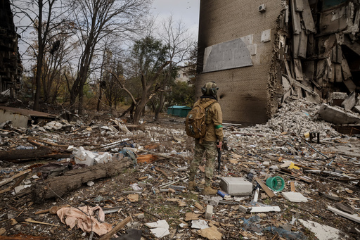 In this photo taken on Oct.13, 2025 and provided by Ukraine's 24th Mechanized Brigade press service, a Ukrainian soldier walks amid the ruins in Kostiantynivka, a frontline town where some 5000 people still stay with no water, electricity and gas supply in the site of heaviest battles with the Russian troops in the Donetsk region, Ukraine. (Oleg Petrasiuk/Ukraine's 24th Mechanized Brigade via AP) In this photo taken on Oct.13, 2025 and provided by Ukraine's 24th Mechanized Brigade press service, a Ukrainian soldier walks amid the ruins in Kostiantynivka, a frontline town where some 5000 people still stay with no water, electricity and gas supply in the site of heaviest battles with the Russian troops in the Donetsk region, Ukraine. (Oleg Petrasiuk/Ukraine's 24th Mechanized Brigade via AP)