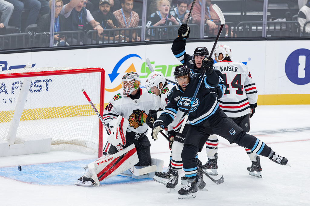 FILE - Utah Mammoth left wing Anders Lee (72) and center Logan Cooley (92) celebrate a goal against Chicago Blackhawks goalie Arvid Soderblom (40) and center Frank Nazar (91) during the second period of an NHL hockey game, Oct. 1, 2026, in Salt Lake City. (AP Photo/Melissa Majchrzak, File)