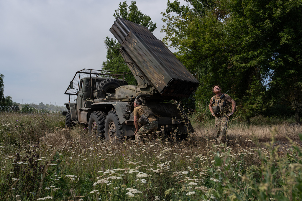 In this photo provided by Ukraine's 93rd Kholodnyi Yar Separate Mechanized Brigade press service, soldiers prepare an MRLS BM-21 "Grad" to fire at Russian positions near the frontline city of Kramatorsk, Donetsk region, Ukraine, Tuesday, Aug. 4, 2026. (Iryna Rybakova/Ukraine's 93rd Mechanized Brigade via AP)