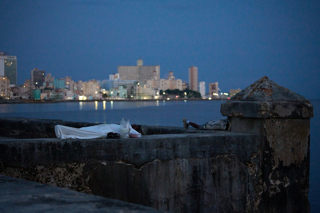 People sleep on the Malecón seawall to escape the heat of their homes during a power outage in Havana, Cuba, Wednesday, Aug. 5, 2026. (AP Photo/Ramon Espinosa)