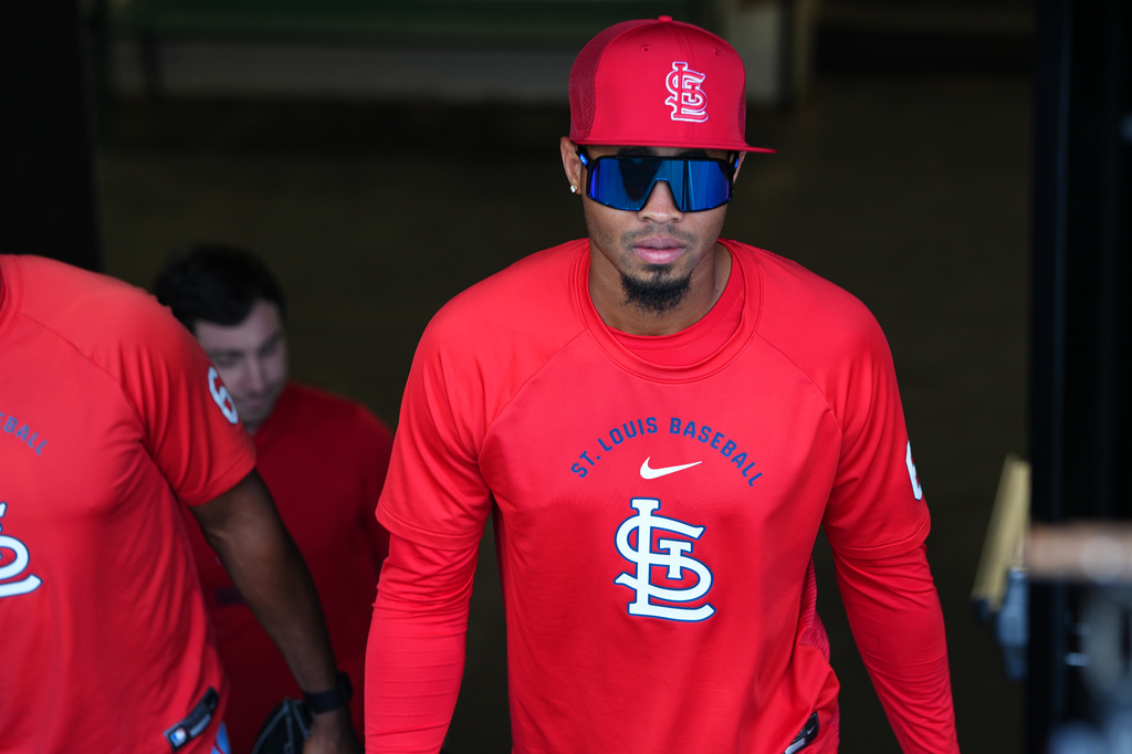 St. Louis Cardinals relief pitcher Hancel Rincon emerges from the clubhouse to take part in practice before a baseball game against the Colorado Rockies, Saturday, Sept. 5, 2026, in Denver. (AP Photo/David Zalubowski)