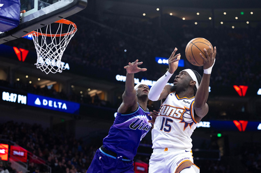 Phoenix Suns center Mark Williams (15) looks to shoot over Utah Jazz forward Taylor Hendricks, left, during the first half of an NBA basketball game, Monday, Oct. 27, 2025, in Salt Lake City. (AP Photo/Anna Fuder) Phoenix Suns center Mark Williams (15) looks to shoot over Utah Jazz forward Taylor Hendricks, left, during the first half of an NBA basketball game, Monday, Oct. 27, 2025, in Salt Lake City. (AP Photo/Anna Fuder)
