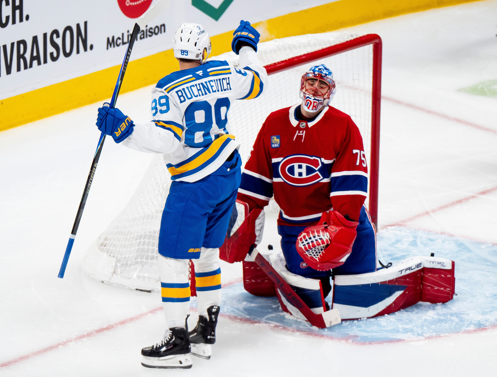 St. Louis Blues' Pavel Buchnevich (89) celebrates after scoring against Montreal Canadiens goaltender Jakub Dobes (75) during second-period NHL hockey game action in Montreal, Sunday, Dec. 7, 2025. (Christopher Katsarov/The Canadian Press via AP)
