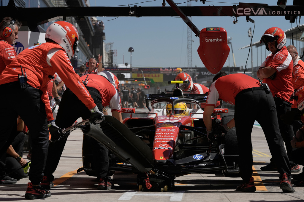 Ferrari driver Lewis Hamilton of Britain gets a pit service during the first free practice ahead of the Spanish Formula One Grand Prix, in Madrid, Friday, Sept. 11, 2026. (AP Photo/Bernat Armangue)