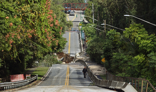 Washed out section of Donnelly Street in Mount Dora — Flooding damage in Lake County after torrential rains last night, on Monday, Oct. 27, 2025. (Ricardo Ramirez Buxeda/Orlando Sentinel via AP) Washed out section of Donnelly Street in Mount Dora — Flooding damage in Lake County after torrential rains last night, on Monday, Oct. 27, 2025. (Ricardo Ramirez Buxeda/Orlando Sentinel via AP)