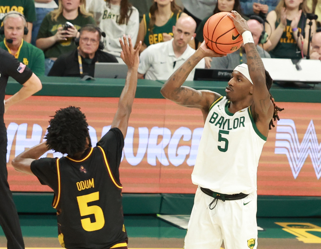 Baylor guard Obi Agbim scores on a 3-point play over Arizona State guard Maurice Odum in the second half of an NCAA college basketball game, Saturday, Feb. 21, 2026, in Waco, Texas. (Rod Aydelotte/Waco Tribune-Herald via AP)