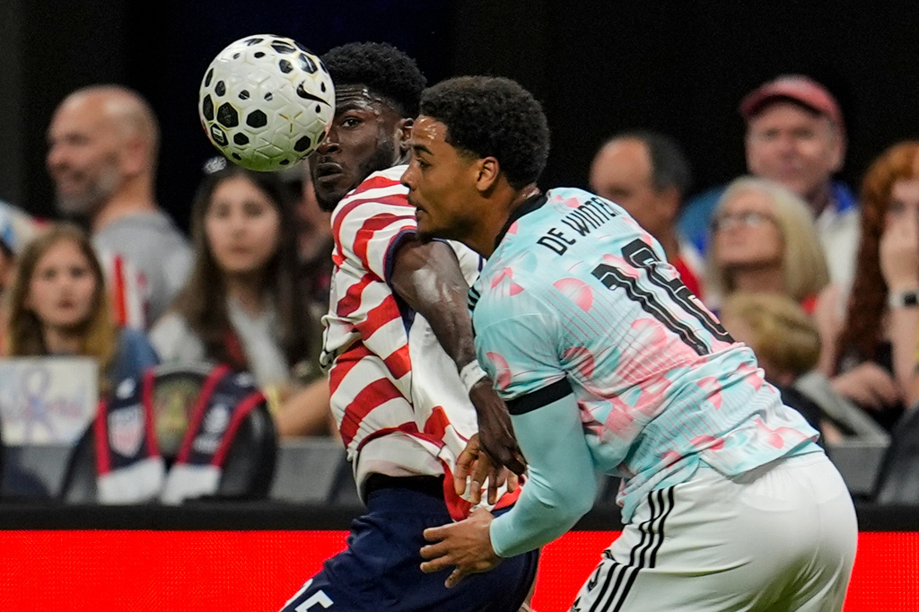 United States' Patrick Agyemang (25) and Belgium's Koni De Winter (16) battle for the ball during the second half of an international friendly soccer match, Saturday, March 28, 2026, in Atlanta. (AP Photo/Mike Stewart)