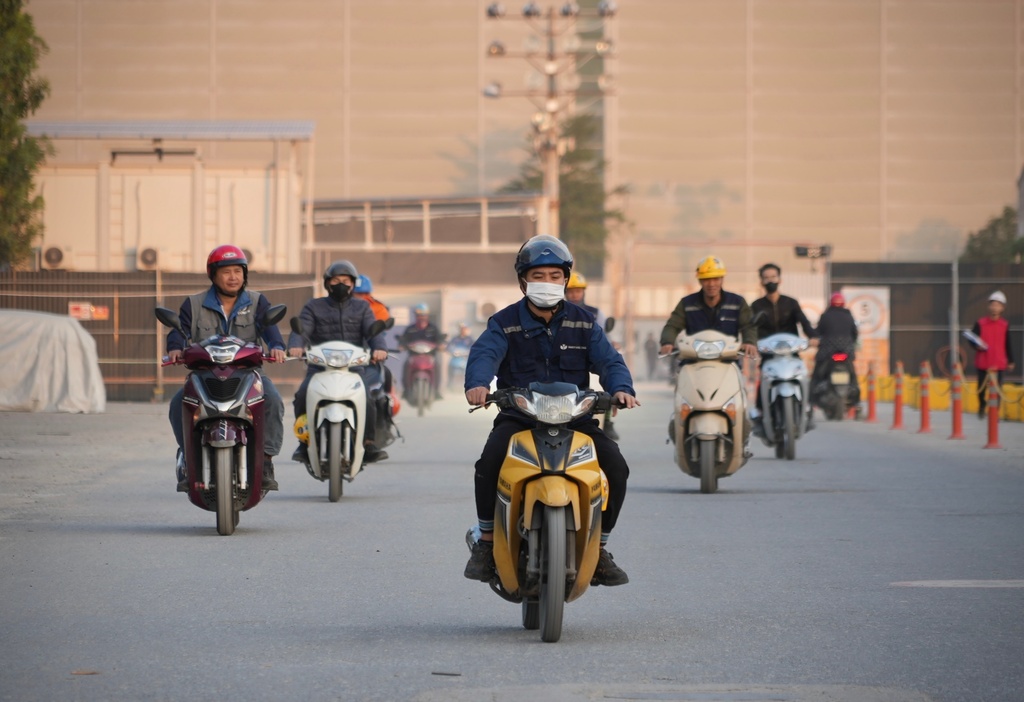 Employees leave after work at Yen Phong Industrial Park in Bac Ninh province, Vietnam, on Dec. 26, 2025. (AP Photo/Hau Dinh)
