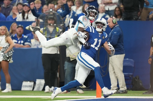 Indianapolis Colts wide receiver Michael Pittman Jr. (11) makes a touchdown catch against Tennessee Titans cornerback Jalyn Armour-Davis (18) during the first half an NFL football game, Sunday, Oct. 26, 2025, in Indianapolis. (AP Photo/AJ Mast) Indianapolis Colts wide receiver Michael Pittman Jr. (11) makes a touchdown catch against Tennessee Titans cornerback Jalyn Armour-Davis (18) during the first half an NFL football game, Sunday, Oct. 26, 2025, in Indianapolis. (AP Photo/AJ Mast)