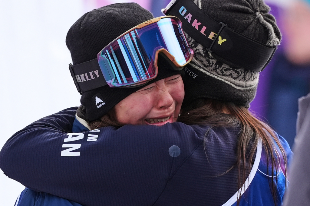 Gold medalist Japan's Mari Fukada, left, celebrates her win alongside bronze medalist Japan's Kokomo Murase after the women's snowboarding slopestyle finals at the 2026 Winter Olympics, in Livigno, Italy, Wednesday, Feb. 18, 2026. (AP Photo/Lindsey Wasson)