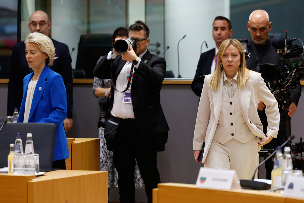European Commission President Ursula von der Leyen, left, and Italy's Prime Minister Giorgia Meloni, right, arrive for a round table meeting at the EU Summit in Brussels, Thursday, Dec. 18, 2025. (AP Photo/Geert Vanden Wijngaert)