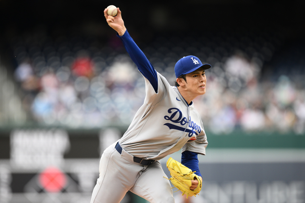 Los Angeles Dodgers starting pitcher Roki Sasaki (11) throws during the first inning of a baseball game against the Washington Nationals, Sunday, April 5, 2026, in Washington. (AP Photo/Nick Wass)
