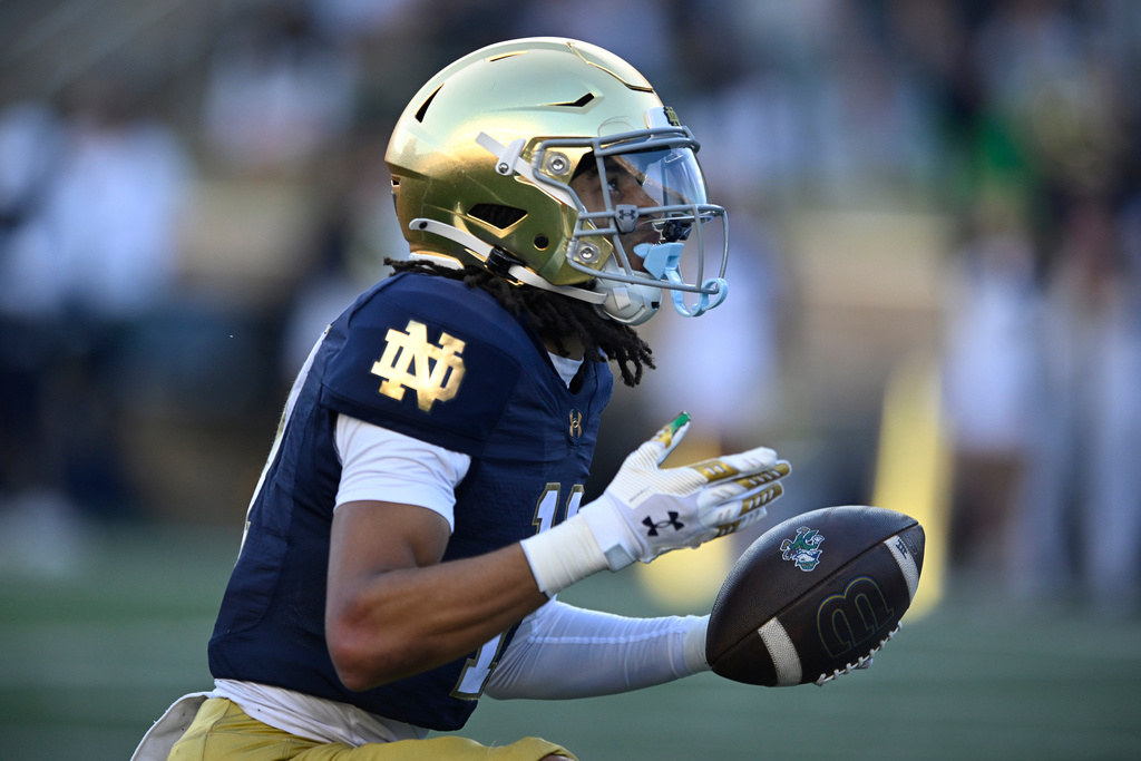 Notre Dame wide receiver KK Smith celebrates after catching a touchdown pass during the third quarter of an NCAA college football game against North Carolina State, Saturday, Oct. 11, 2025, in South Bend, Ind. (AP Photo/Paul Beaty)