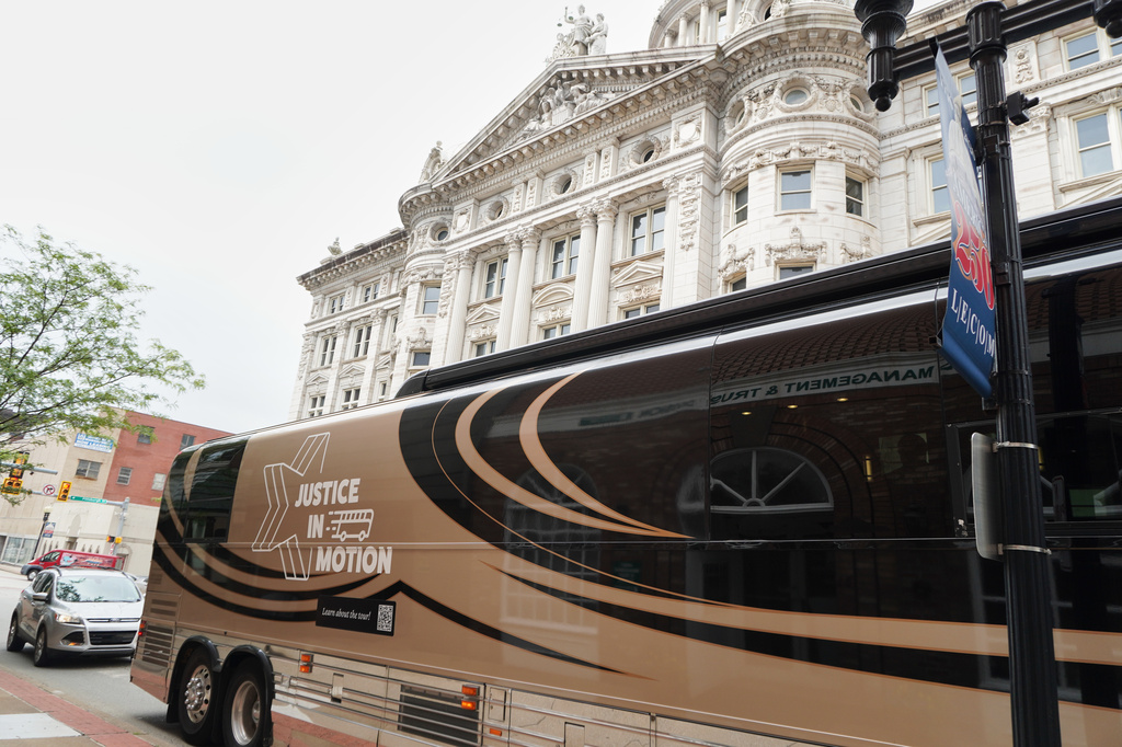A tour bus carrying retired judges on a tour through the Rust Belt to defend judicial independence is parted outside the Westmoreland County Courthouse in Greensburg, Pa., on Tuesday, July 7, 2026. (Keep Our Republic via AP)