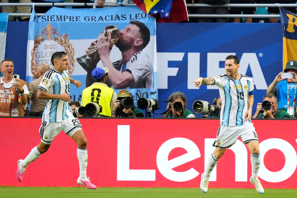 Argentina's Lionel Messi, right, celebrates scoring his side's opening goal against Cape Verde during the World Cup round of 32 soccer match in Miami Gardens, Fla., Friday, July 3, 2026. (AP Photo/Rebecca Blackwell)