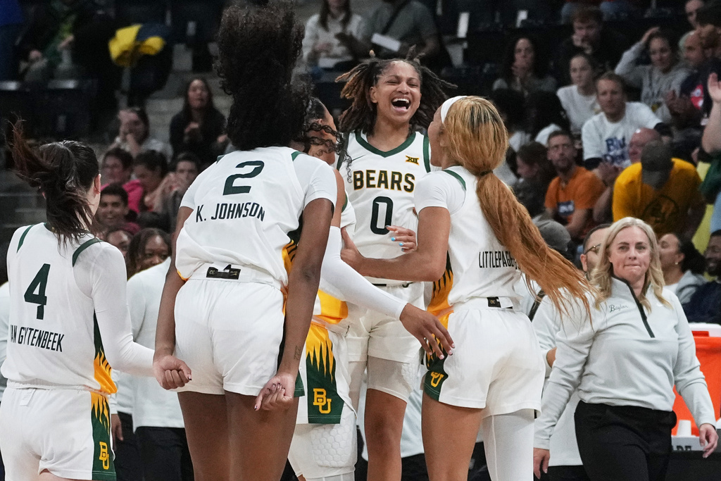 Baylor guard Taliah Scott (0) celebrates with teammates after an NCAA college basketball game against Duke Monday, Nov. 3, 2025 in Paris. (AP Photo/Thibault Camus)