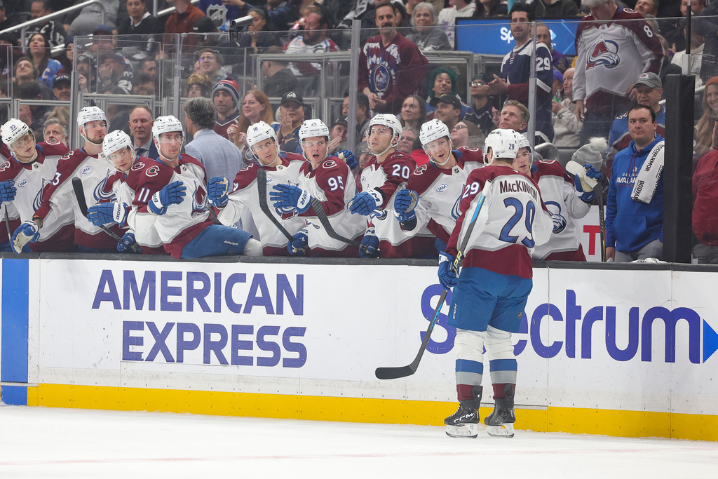 Colorado Avalanche center Nathan MacKinnon celebrates with the bench after scoring during the first period of an NHL hockey game against the Los Angeles Kings Monday, March. 2, 2026 in Los Angeles. (AP Photo/Ryan Sun)
