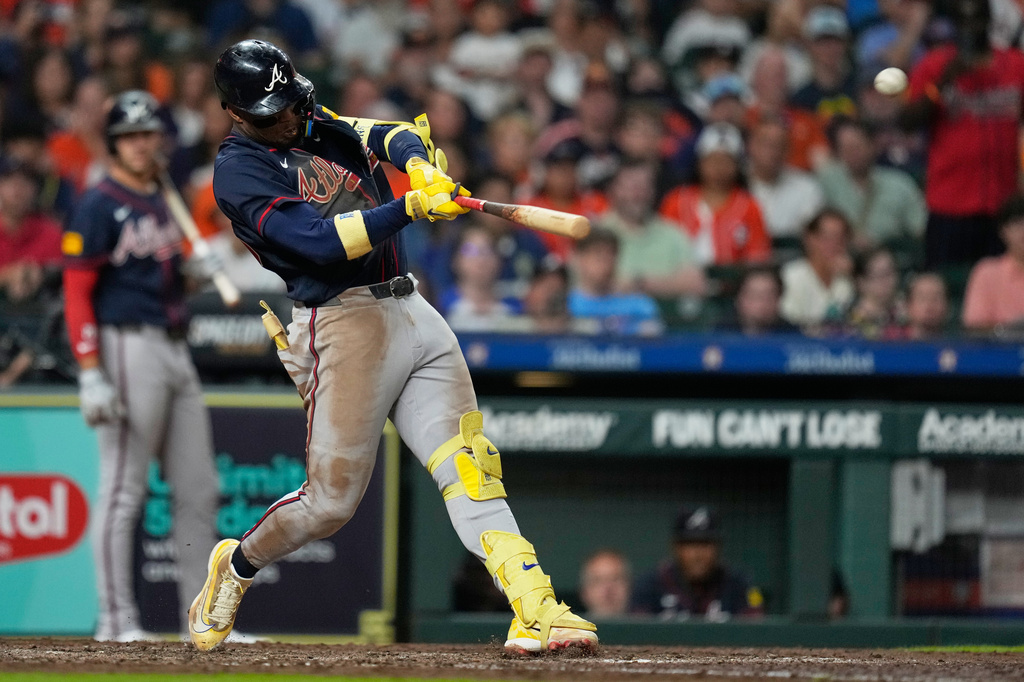 Atlanta Braves' Ronald Acuña Jr. hits a grand slam during the seventh inning of a baseball game against the Houston Astros in Houston, Saturday, Sept. 19, 2026. (AP Photo/Ashley Landis)