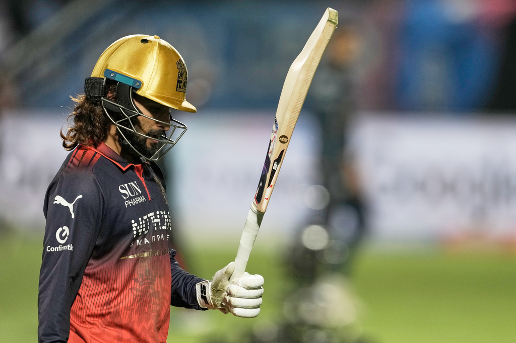 Royal Challengers Bengaluru's captain Rajat Patidar acknowledges the applause from the crowd as he leaves the field at the end of their innings during the Indian Premier League cricket match between Gujarat Titans and Royal Challengers Bengaluru in Dharamshala, India, Tuesday, May 26, 2026. (AP Photo/Ashwini Bhatia)