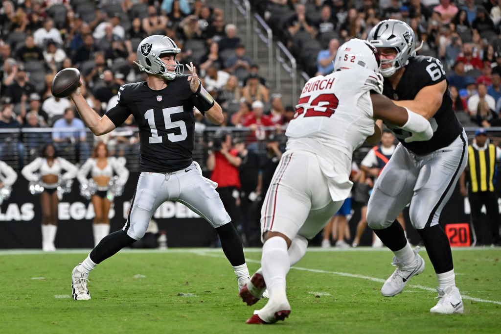 Las Vegas Raiders quarterback Fernando Mendoza (15) throws against the Arizona Cardinals during the first half of a preseason NFL football game, Thursday, Aug. 13, 2026, in Las Vegas. (AP Photo/David Becker)