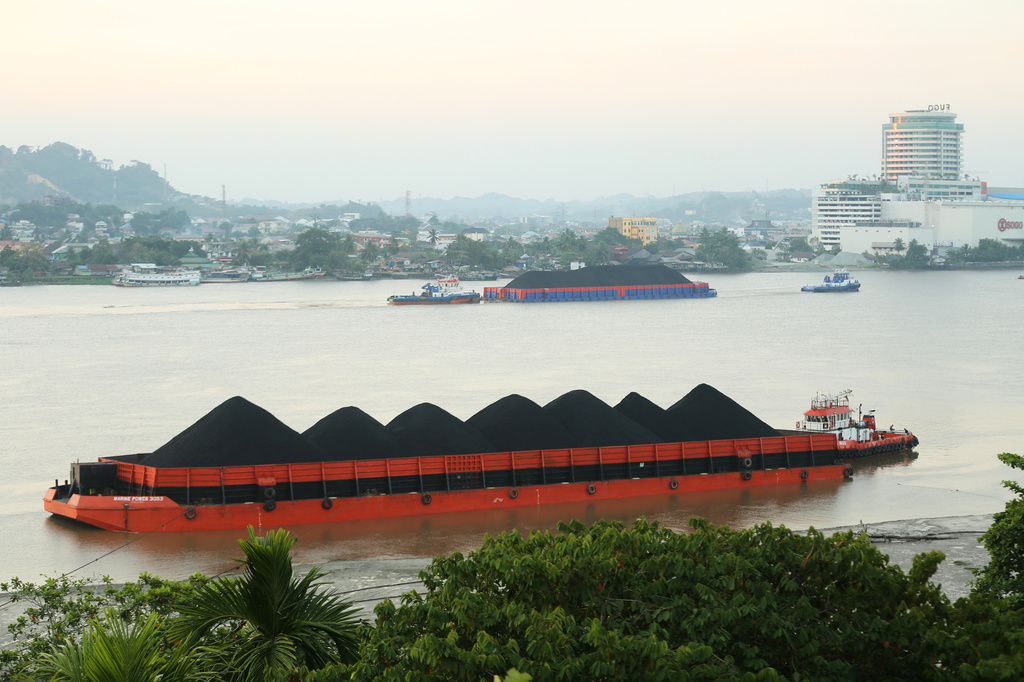 Barges of coal are seen on the Mahakam River in Samarinda, East Kalimantan, Indonesia, on Aug. 19, 2026. (AP Photo/Ahmad Mulia Panjaitan)