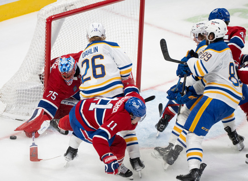 Montreal Canadiens goaltender Jakub Dobes (75) makes a save as Buffalo Sabres' Rasmus Dahlin (26) and Canadiens' Brendan Gallagher (11) look for the rebound during second period NHL hockey action in Montreal on Monday, Oct. 20, 2025. (Christinne Muschi/The Canadian Press via AP) Montreal Canadiens goaltender Jakub Dobes (75) makes a save as Buffalo Sabres' Rasmus Dahlin (26) and Canadiens' Brendan Gallagher (11) look for the rebound during second period NHL hockey action in Montreal on Monday, Oct. 20, 2025. (Christinne Muschi/The Canadian Press via AP)
