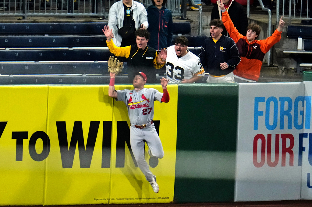 St. Louis Cardinals left fielder Nathan Church (27) leaps to make the catch on a fly ball by Pittsburgh Pirates' Nick Gonzales to end the baseball game in Pittsburgh, Wednesday, April 29, 2026. (AP Photo/Gene J. Puskar)