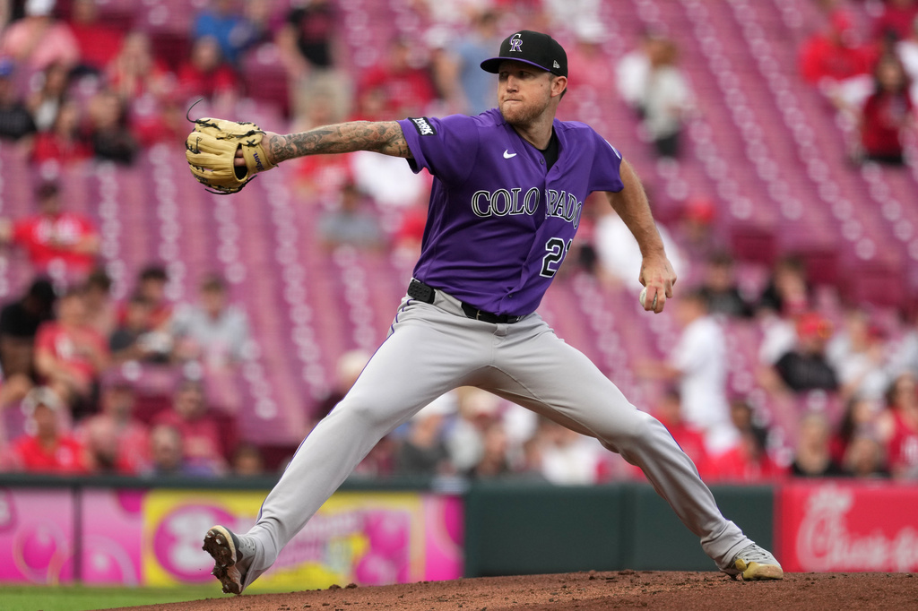 Colorado Rockies' Kyle Freeland delivers a pitch during the first inning of a baseball game against the Cincinnati Reds, Tuesday, April 28, 2026, in Cincinnati. (AP Photo/Kareem Elgazzar)