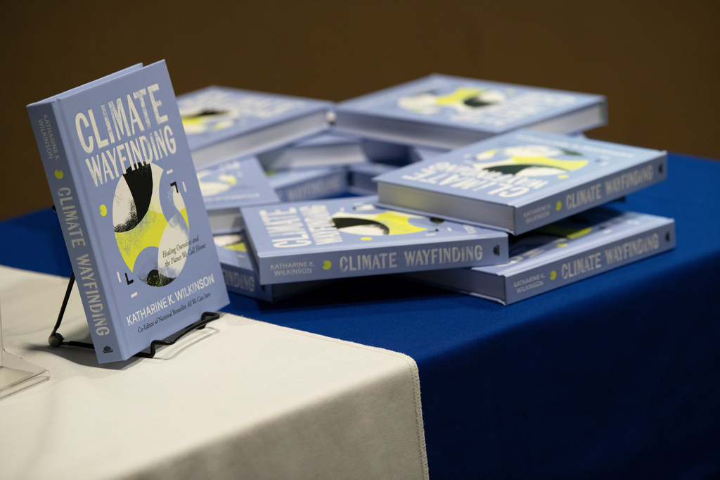 Katharine Wilkinson's book "Climate Wayfinding: Healing Ourselves and the Planet We Call Home" is displayed at her talk on April 14, 2026, in Washington. (AP Photo/Michael Phillis)