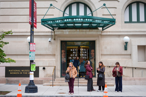 People are seen waiting outside the main entrance of the National Museum of Women in the Arts in downtown Washington, Wednesday, Oct. 29, 2025. (AP Photo/Pablo Martinez Monsivais) People are seen waiting outside the main entrance of the National Museum of Women in the Arts in downtown Washington, Wednesday, Oct. 29, 2025. (AP Photo/Pablo Martinez Monsivais)