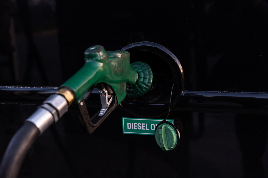 FILE - A nozzle pumps diesel into the fuel tank of bus in Orange, Calif., Tuesday, April 7, 2026. (AP Photo/Jae C. Hong, File)