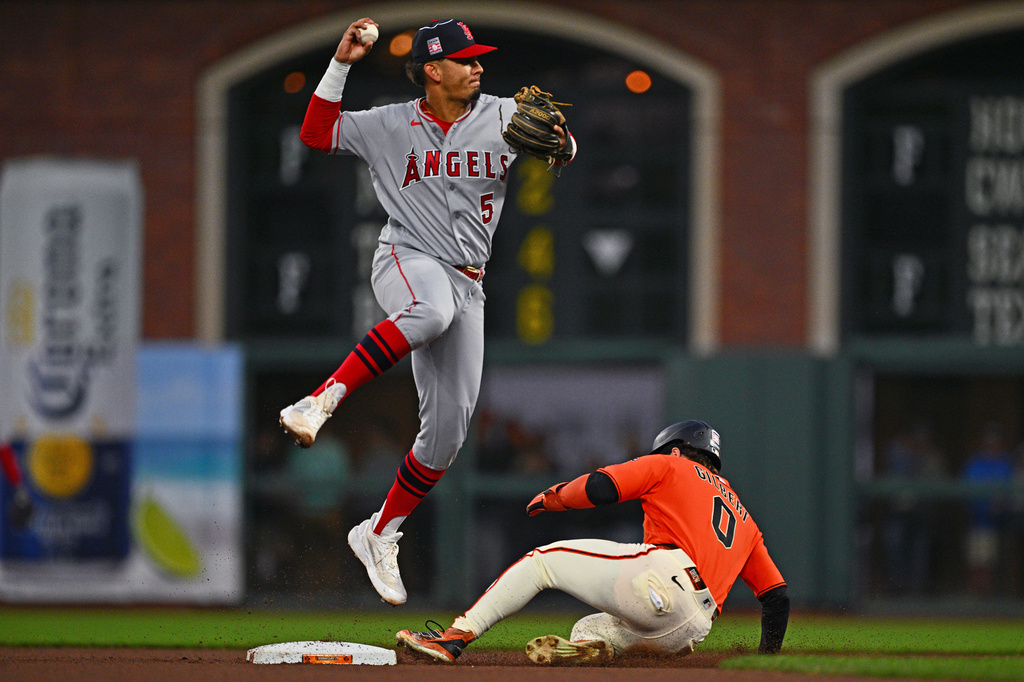 Los Angeles Angels' Vaughn Grissom (5) throws to first base for the double play as San Francisco Giants' Drew Gilbert (0) is forced out at second base in the fourth inning of their MLB game at Oracle Park in San Francisco, Calif., on Friday, July 24, 2026. (Jose Carlos Fajardo/Bay Area News Group via AP)