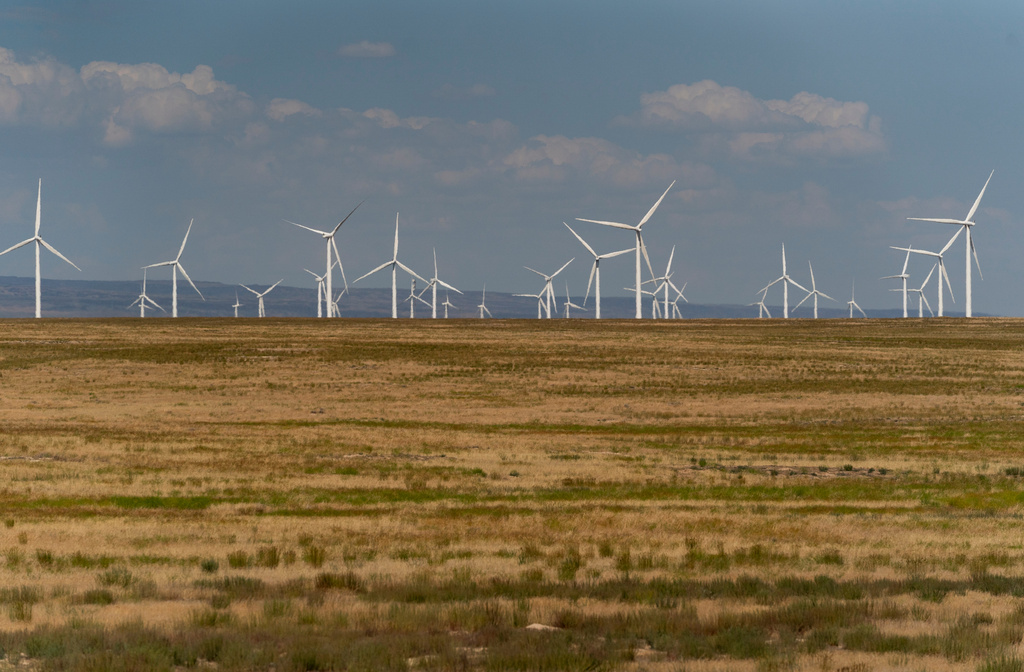 FILE - Wind turbines are seen from Interstate-84, July 9, 2023, near Hammett, Idaho. (AP Photo/Lindsey Wasson, File)