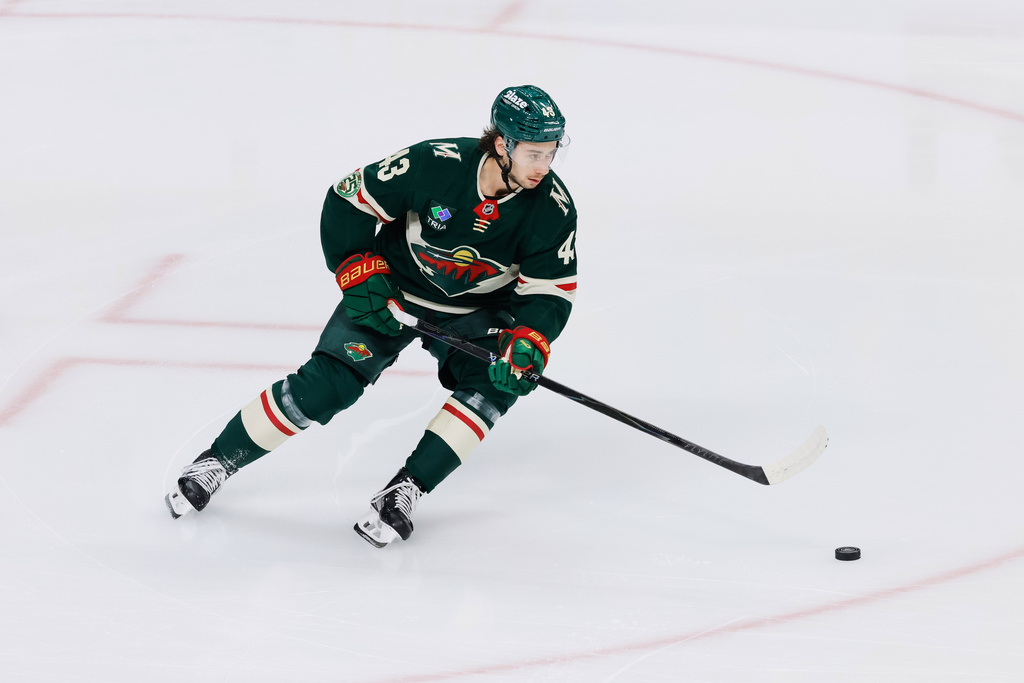 Minnesota Wild defenseman Quinn Hughes warms up before an NHL hockey game against the Boston Bruins, Sunday, Dec. 14, 2025, in St. Paul, Minn. (AP Photo/Bailey Hillesheim)
