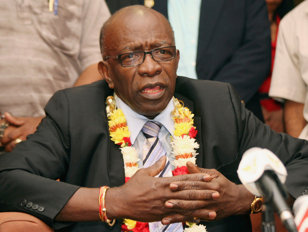 FILE - Suspended FIFA executive Jack Warner gestures during a news conference at the airport in Port-of-Spain, Trinidad and Tobago, June 2, 2011. (AP Photo/Shirley Bahadur, File)