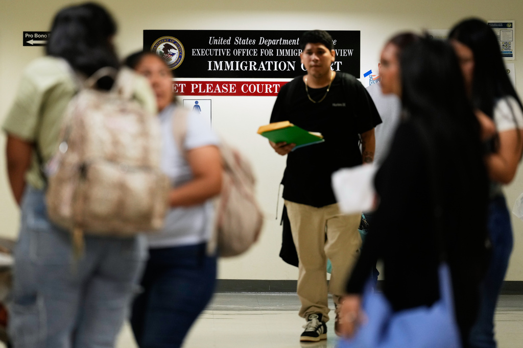 People arrive for immigration court hearings in New York, Monday, July 27, 2026. (AP Photo/Seth Wenig)