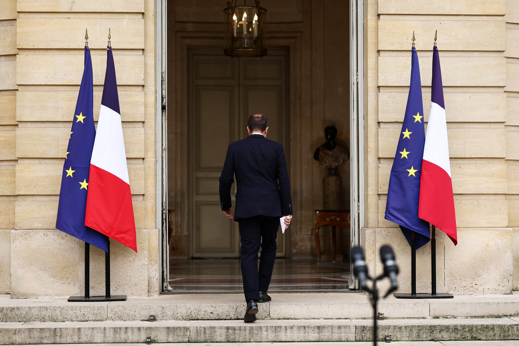 French outgoing Prime Minister Sebastien Lecornu, who resigned just a day after naming his government, walks back after delivering his statement at the Hotel Matignon in Paris, Monday, Oct. 6, 2025. (Stephane Mahe/Pool via AP)