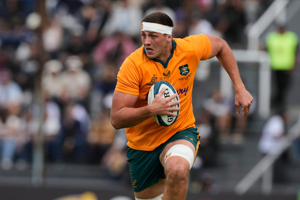 Australia Josh Canham runs with the ball during a rugby test match against Argentina in Jujuy, Argentina, Saturday, Aug. 29, 2026. (AP Photo/Gustavo Garello)
