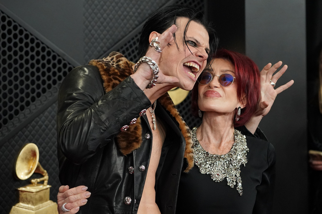 Yungblud, left, and Sharon Osbourne arrive at the 68th annual Grammy Awards on Sunday, Feb. 1, 2026, in Los Angeles. (Photo by Jordan Strauss/Invision/AP)