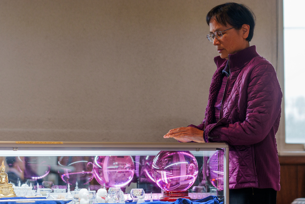 Devotee Sandra Chen meditates at Wei Mountain Temple, in Rosemead, Calif., Saturday, Feb. 17, 2024. (AP Photo/Damian Dovarganes)