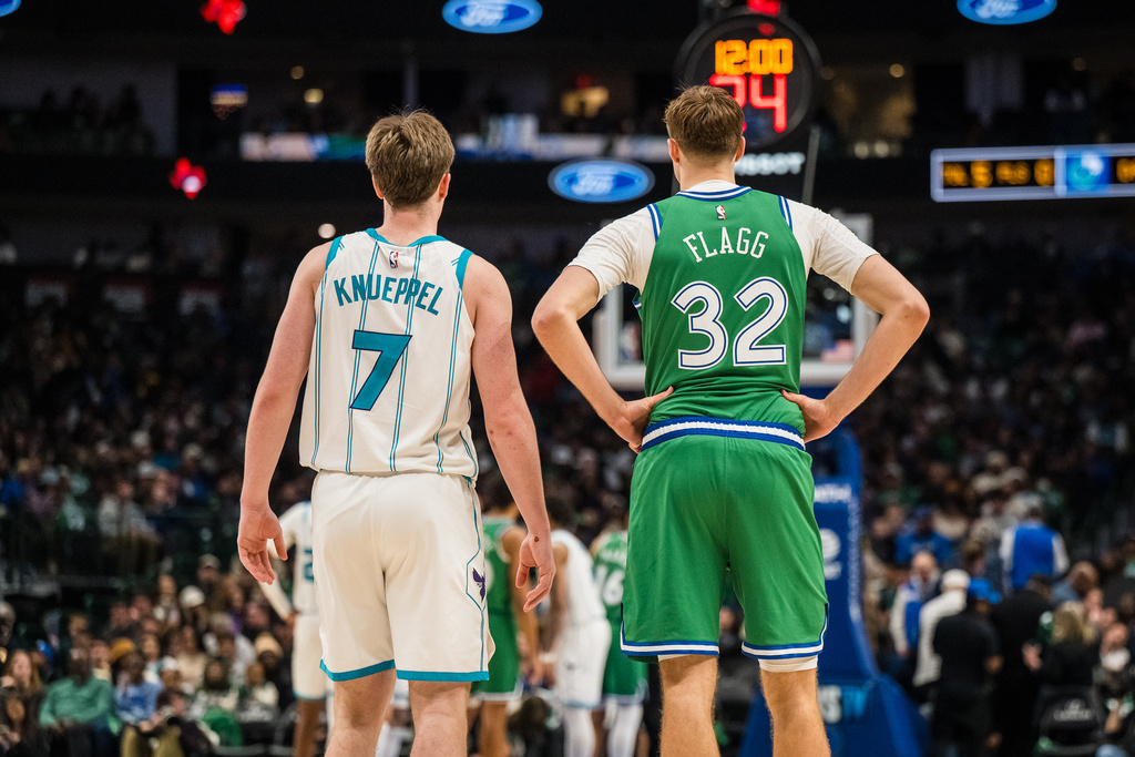 Charlotte Hornets guard Kon Knueppel (7) and Dallas Mavericks forward Cooper Flagg (32) wait for play to start during an NBA basketball game, Thursday, Jan. 29, 2026, in Dallas. (AP Photo/Jessica Tobias)
