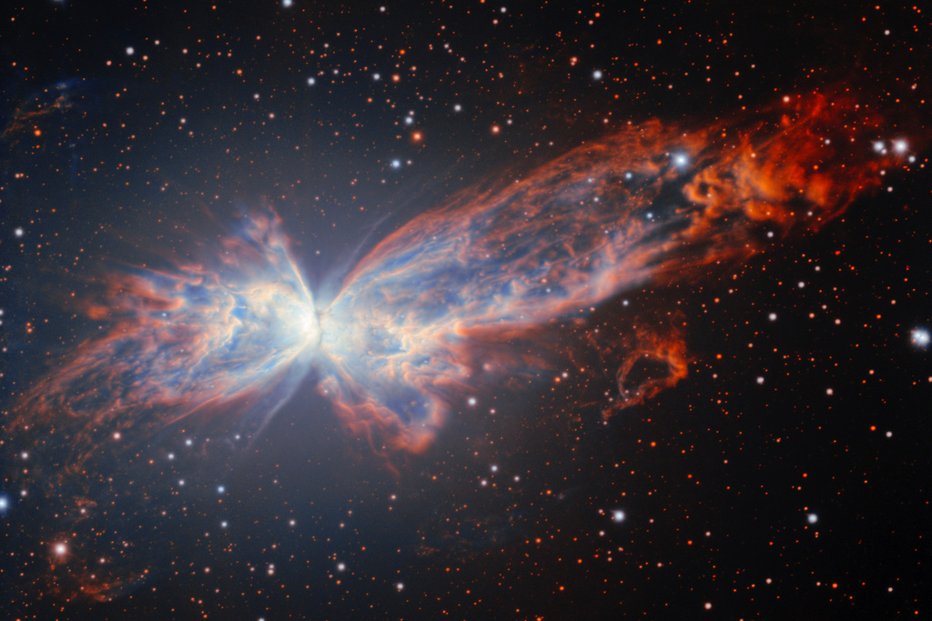 This image provided by NSF NOIRLab shows NGC 6302, a billowing planetary nebula that resembles a cosmic butterfly. (NSF NOIRLab via AP)