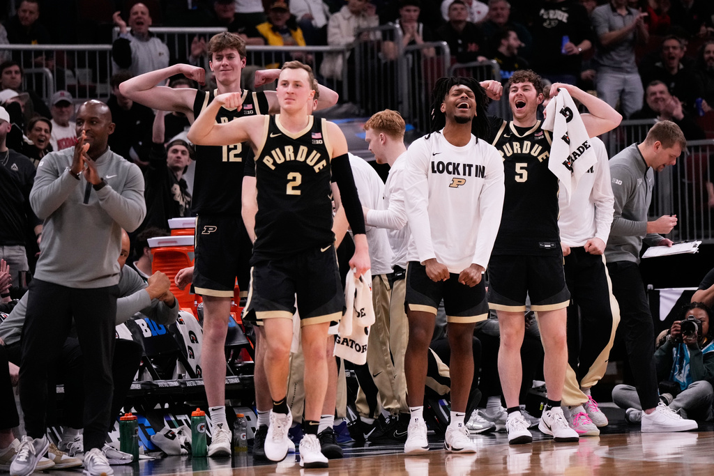 Purdue players celebrate after center Oscar Cluff (not shown) scored a basket during the first half of an NCAA college basketball game against Nebraska in the quarterfinals of the Big 10 Conference tournament, Friday, March 13, 2026, in Chicago. (AP Photo/Nam Y. Huh)