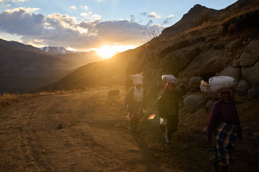 Women carry bags of food in the mountains of Ha Lejone, Lesotho, July 14, 2025. (AP Photo/Bram Janssen) Women carry bags of food in the mountains of Ha Lejone, Lesotho, July 14, 2025. (AP Photo/Bram Janssen)
