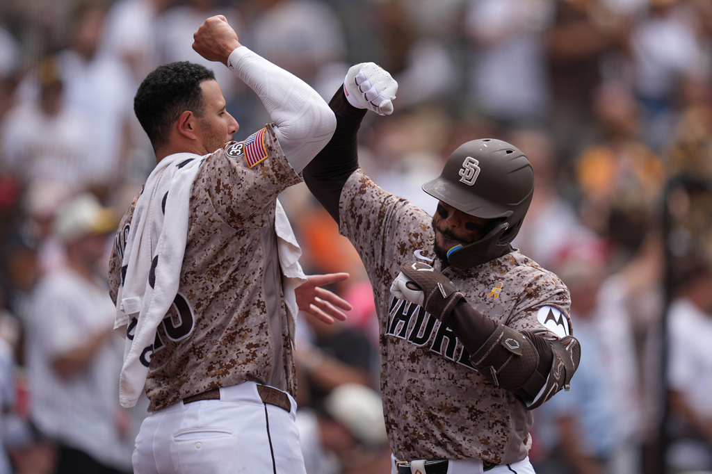 San Diego Padres' Luis Campusano, right, celebrates with Manny Machado after hitting a home run during the seventh inning of a baseball game against the New York Yankees Sunday, Sept. 6, 2026, in San Diego. (AP Photo/Gregory Bull)