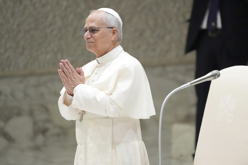 Pope Leo XIV waves as he arrives for his weekly general audience, at The Vatican, Wednesday, Aug.20, 2025. (AP Photo/Gregorio Borgia)