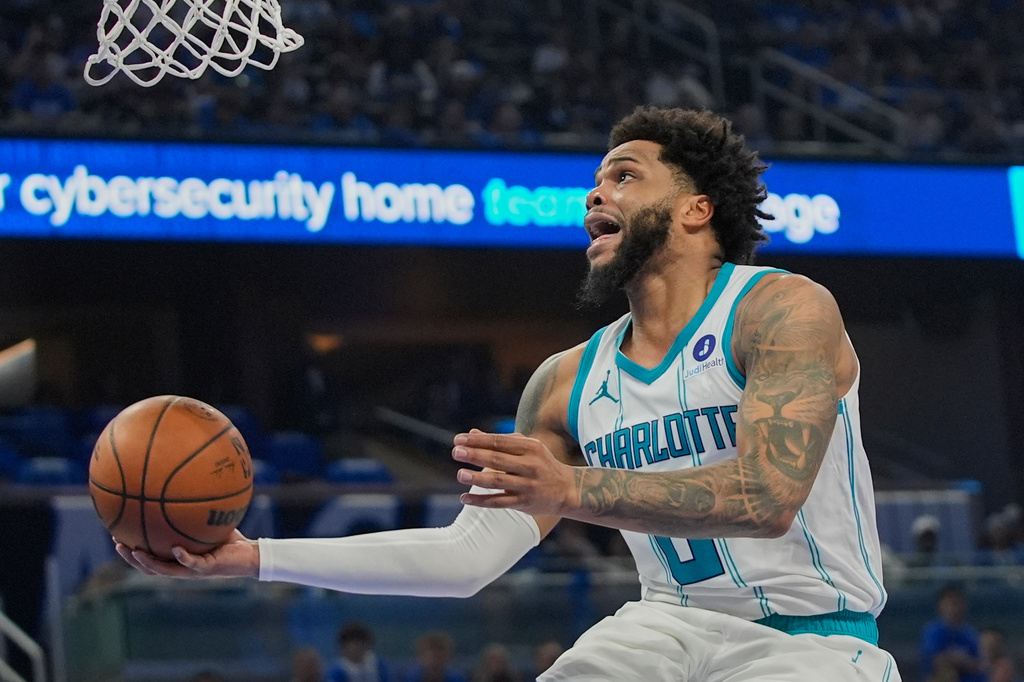 FILE - Charlotte Hornets forward Miles Bridges makes a shot against the Orlando Magic during the second half of an NBA play-in tournament basketball game, Friday, April 17, 2026, in Orlando, Fla. (AP Photo/John Raoux, file)