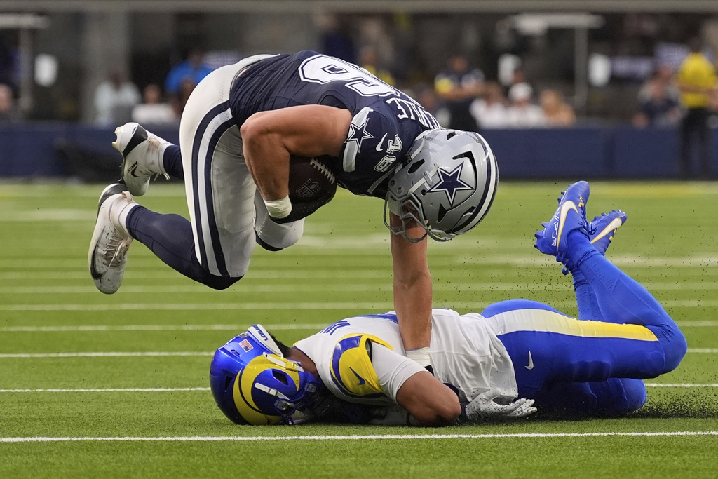 Los Angeles Rams safety Nate Valcarcel (43) tackles Dallas Cowboys tight end Tyler Neville (46) during the first half of an NFL preseason football game, Saturday, Aug. 9, 2025, in Inglewood, Calif. (AP Photo/Mark J. Terrill)