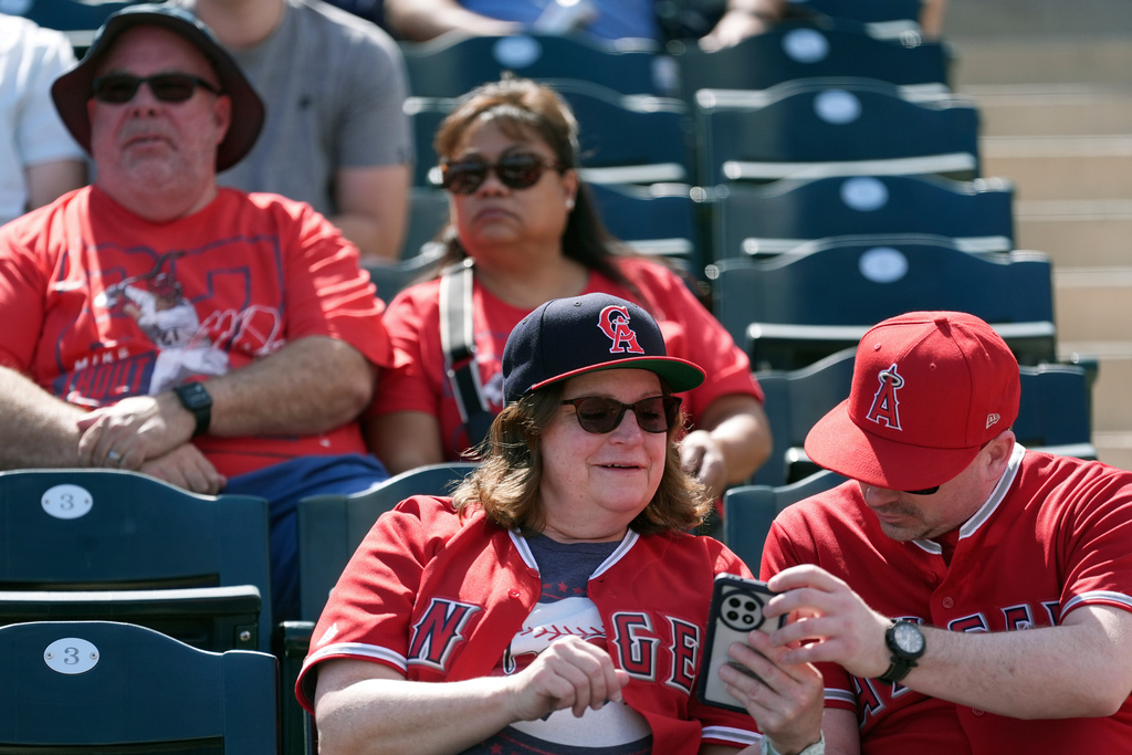 Los Angeles Angels fans wait in the stands prior to a spring training baseball game against the San Diego Padres Tuesday, March 10, 2026, in Tempe, Ariz. (AP Photo/Ross D. Franklin)