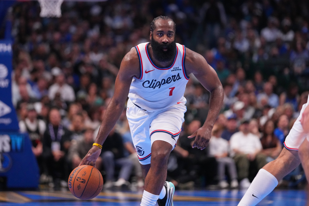 Los Angeles Clippers guard James Harden dribbles up court against the Dallas Mavericks during the second half of an NBA Cup basketball game Friday, Nov. 14, 2025, in Dallas. (AP Photo/Julio Cortez)
